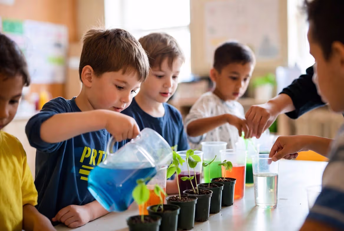 Kindergarten children exploring simple science experiment together