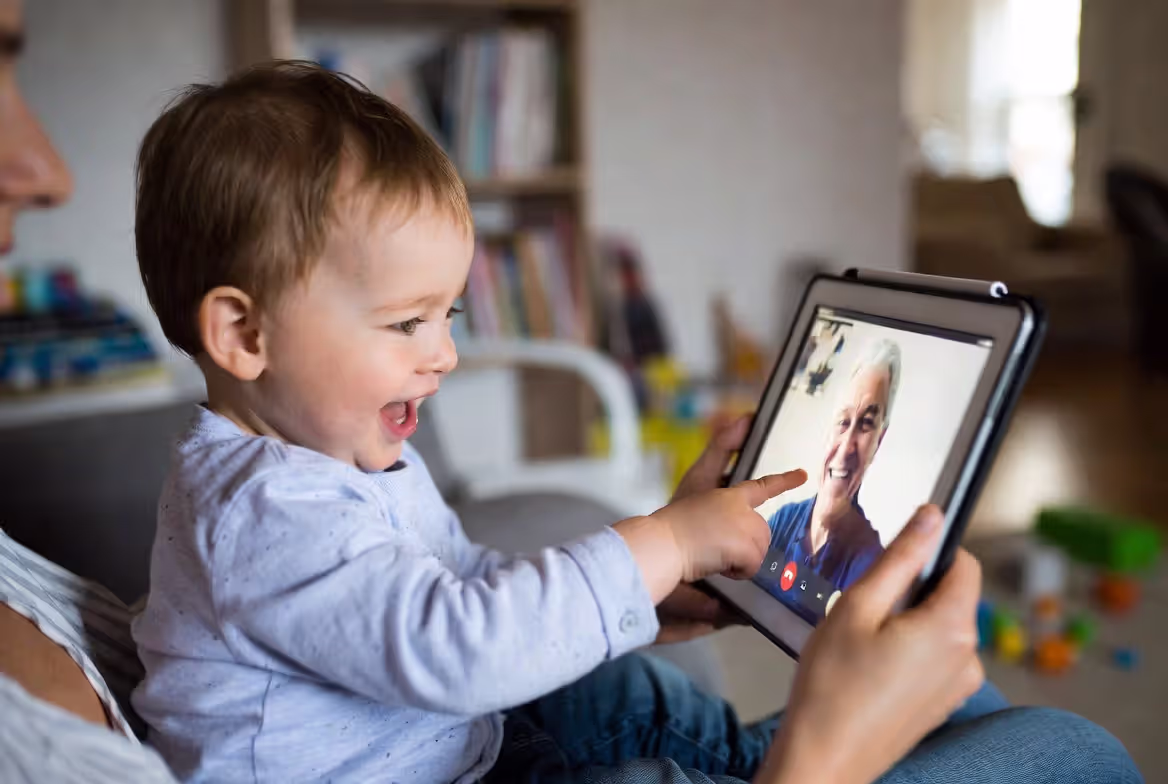 Parent and child discussing educational screen content together after viewing